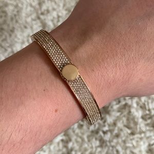 Michael Kors rose gold color bracelet.